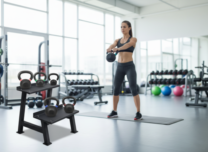 Woman exercising with kettlebells in a gym setting