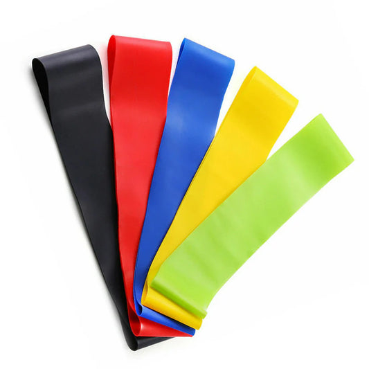 Set of colorful resistance bands on a white background