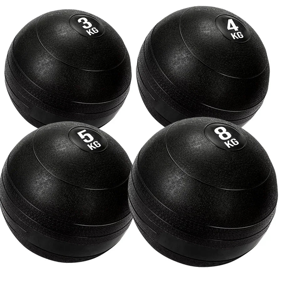 Four black exercise balls with weight markings on a white background